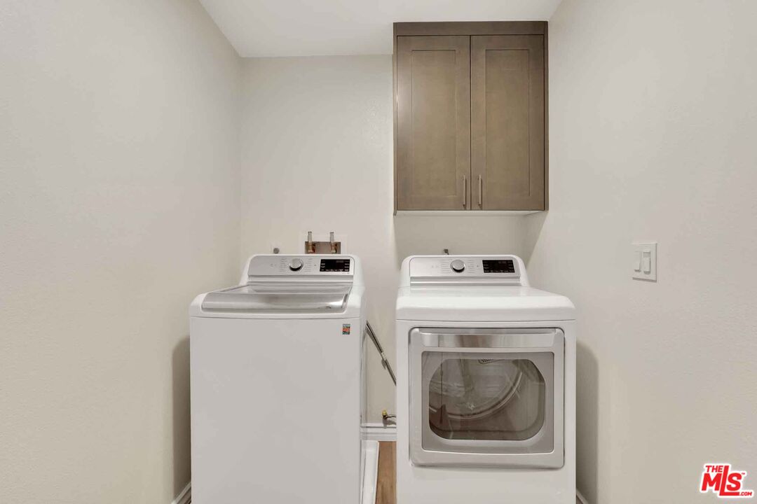 2850 Wagon Wheel Road, Unit 401 Oxnard, CA 93036 - Photo 24 of 31 a utility room with dryer and washer