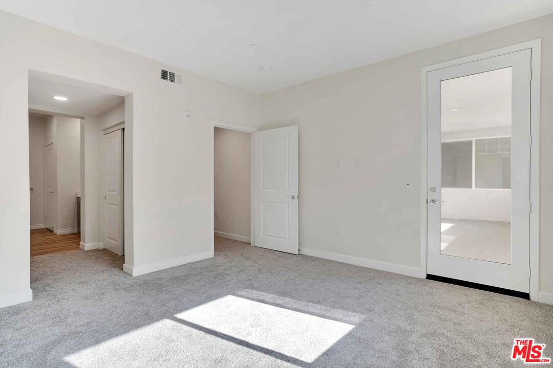 2850 Wagon Wheel Road, Unit 401 Oxnard, CA 93036 - Photo 26 of 31 a view of an empty room with closet and entryway
