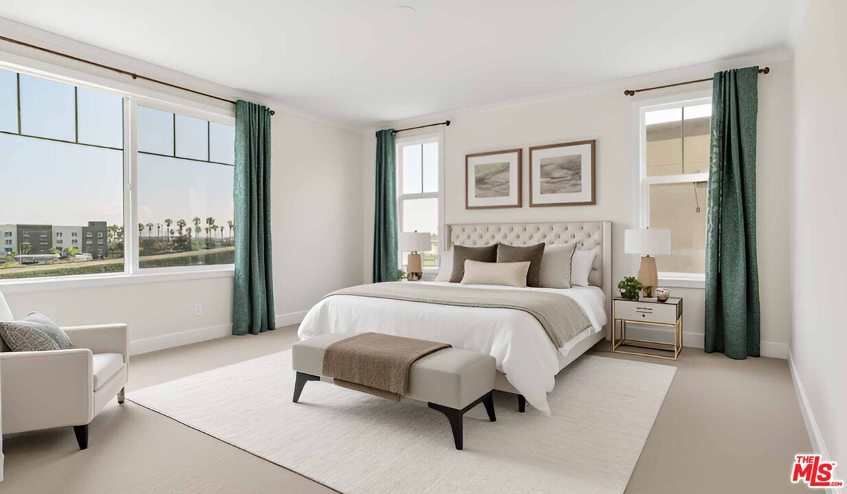 2850 Wagon Wheel Road, Unit 401 Oxnard, CA 93036 - Photo 4 of 31 a bedroom with a bed and glass window