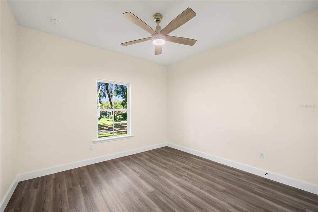 332 Southeast 3rd Avenue Melrose, FL 32666 - Photo 22 of 36 wooden floor in an empty room with a window