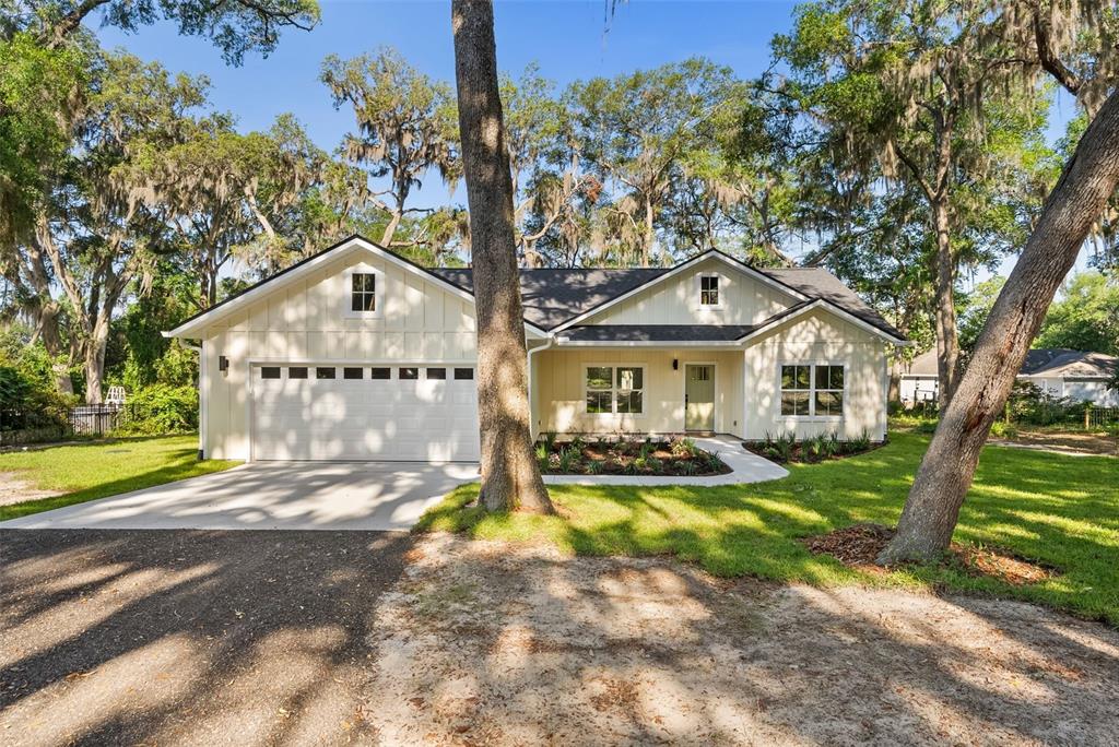 332 Southeast 3rd Avenue Melrose, FL 32666 - Photo 36 of 36 a front view of a house with swimming pool and porch with furniture
