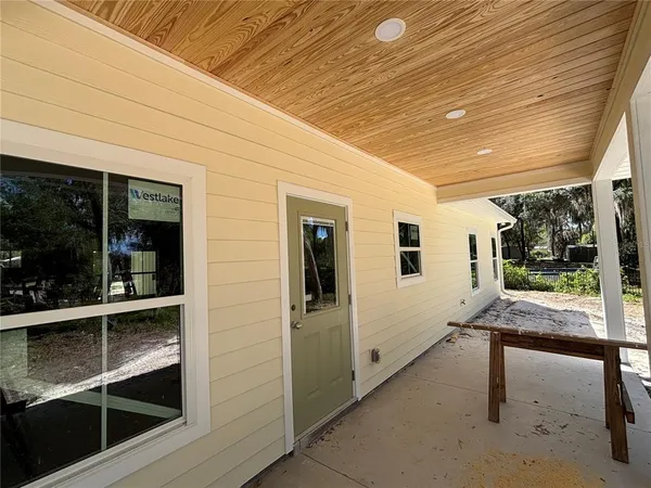 a view of a porch with furniture