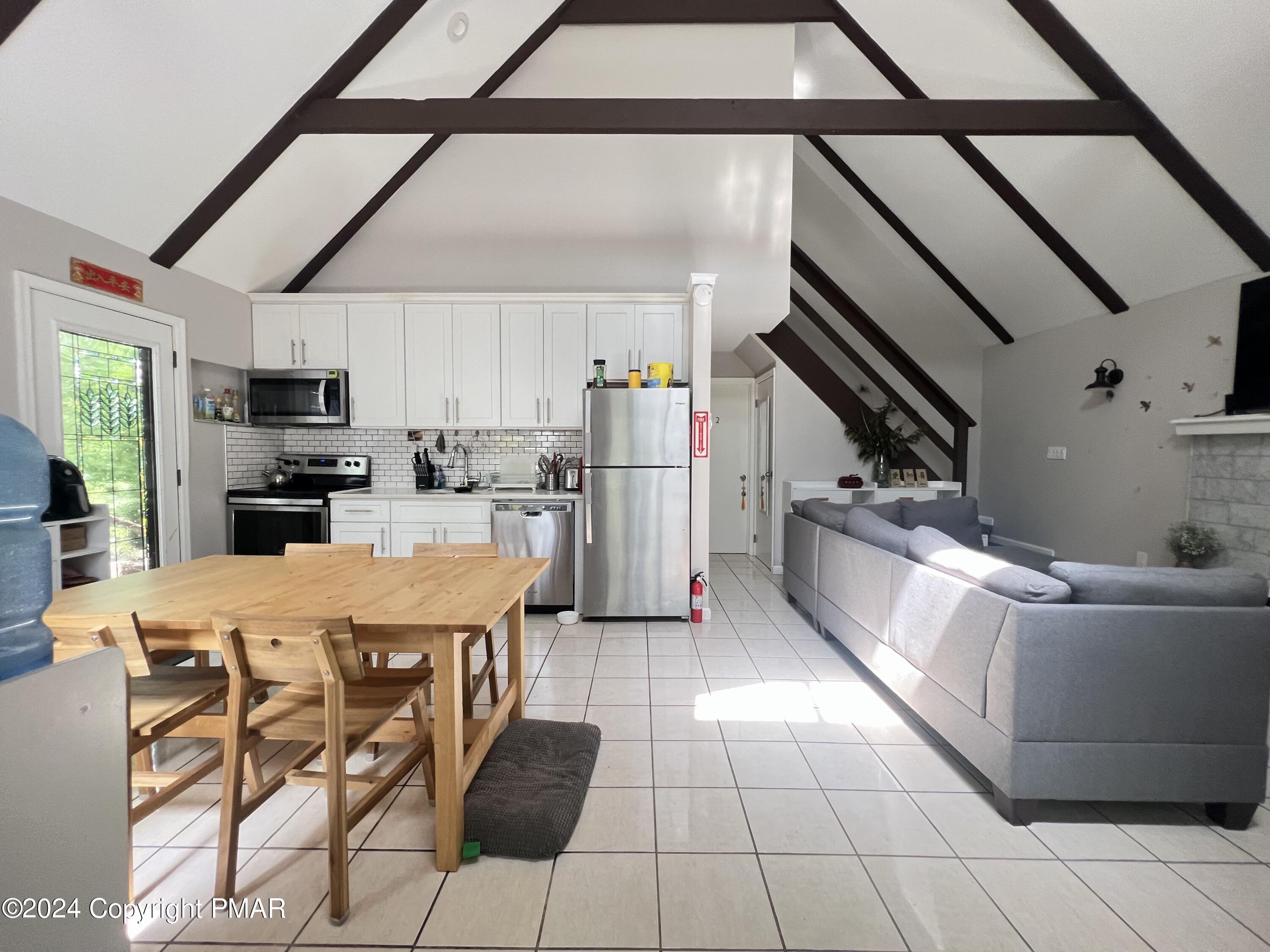236 Regent Street Bushkill, PA 18324 - Photo 11 of 67 a living room with stainless steel appliances kitchen island granite countertop furniture and a kitchen view