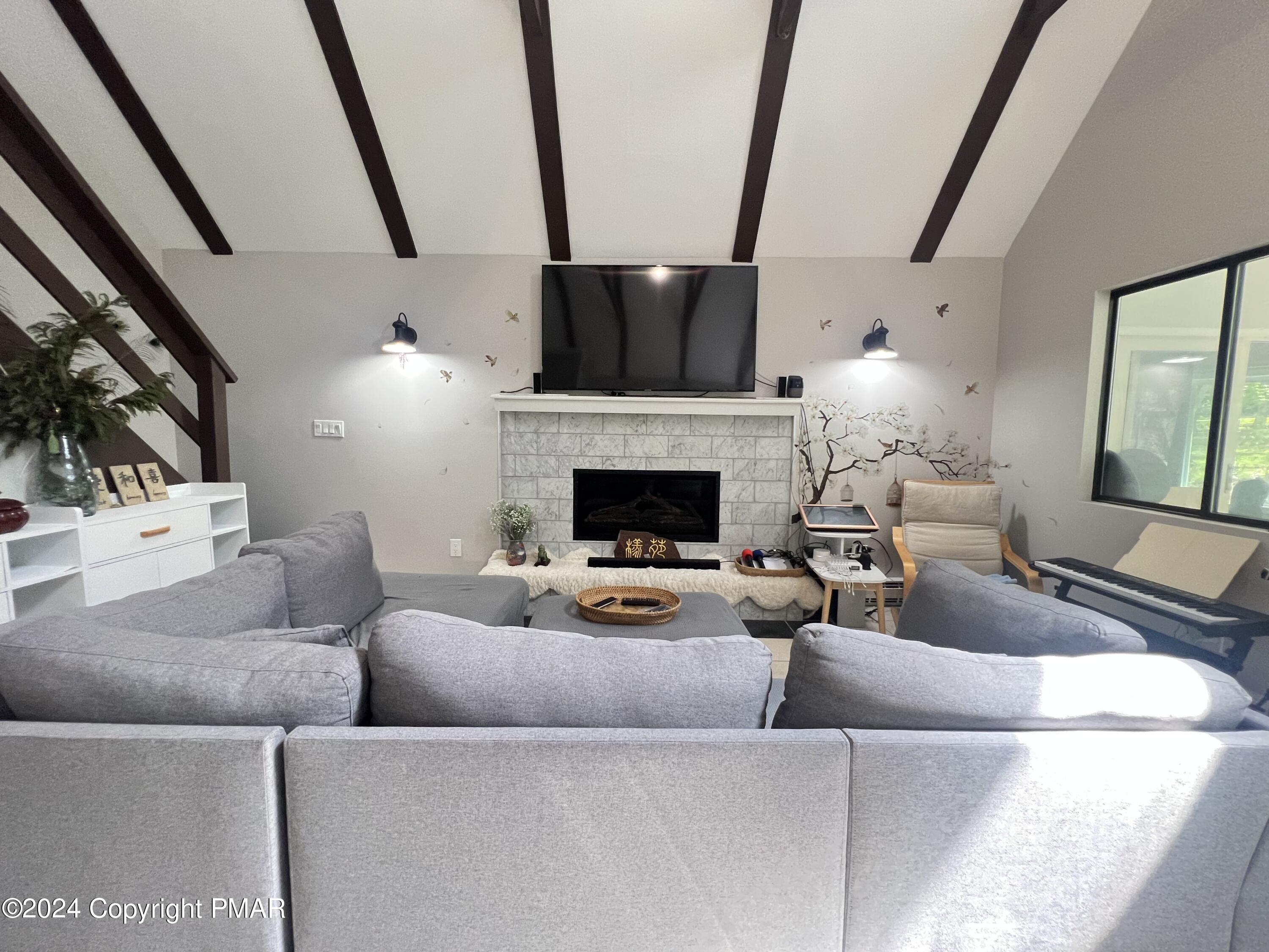 236 Regent Street Bushkill, PA 18324 - Photo 14 of 67 a living room with furniture and a fireplace