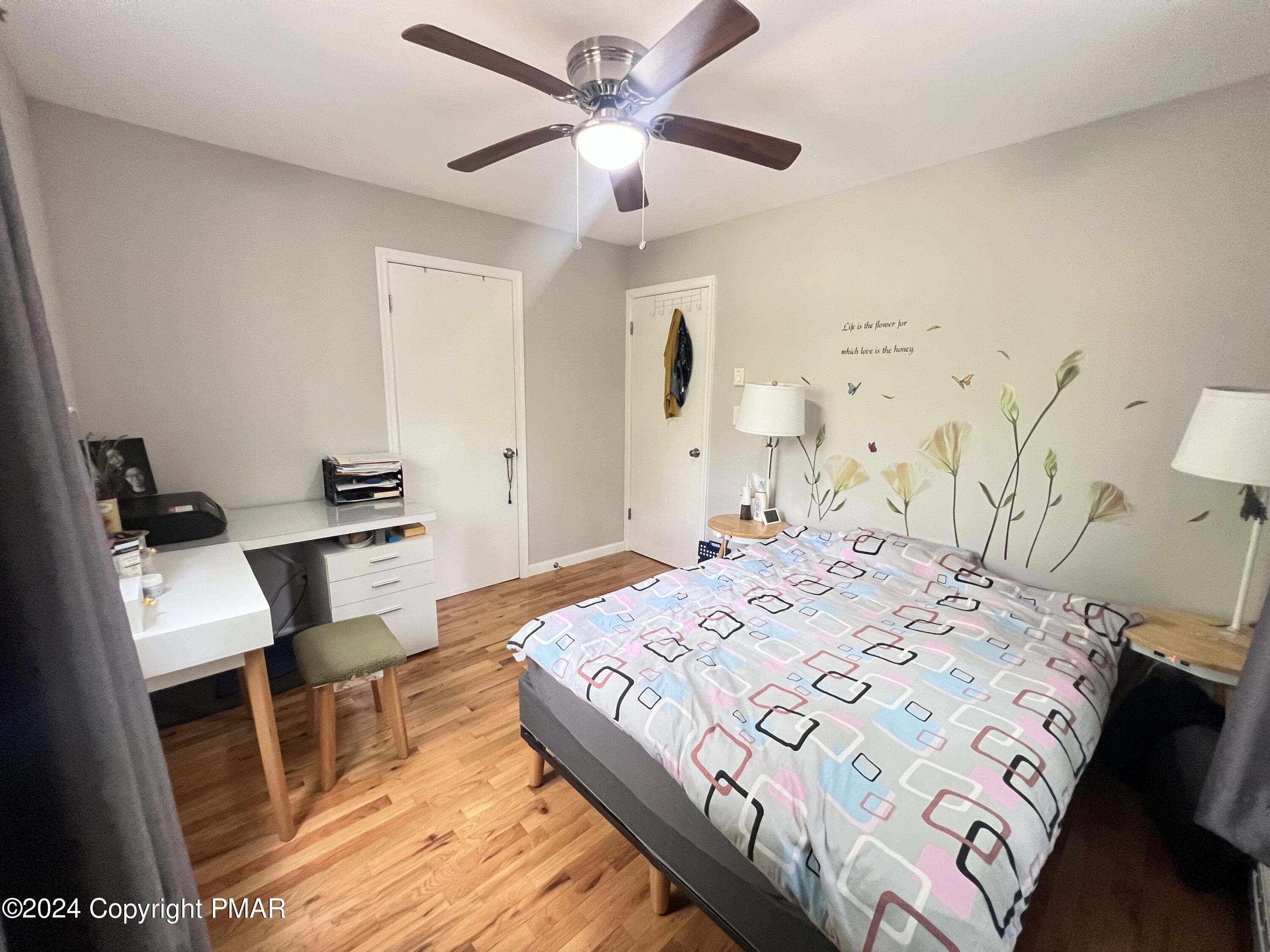 236 Regent Street Bushkill, PA 18324 - Photo 16 of 67 a bedroom with a bed and a table in it