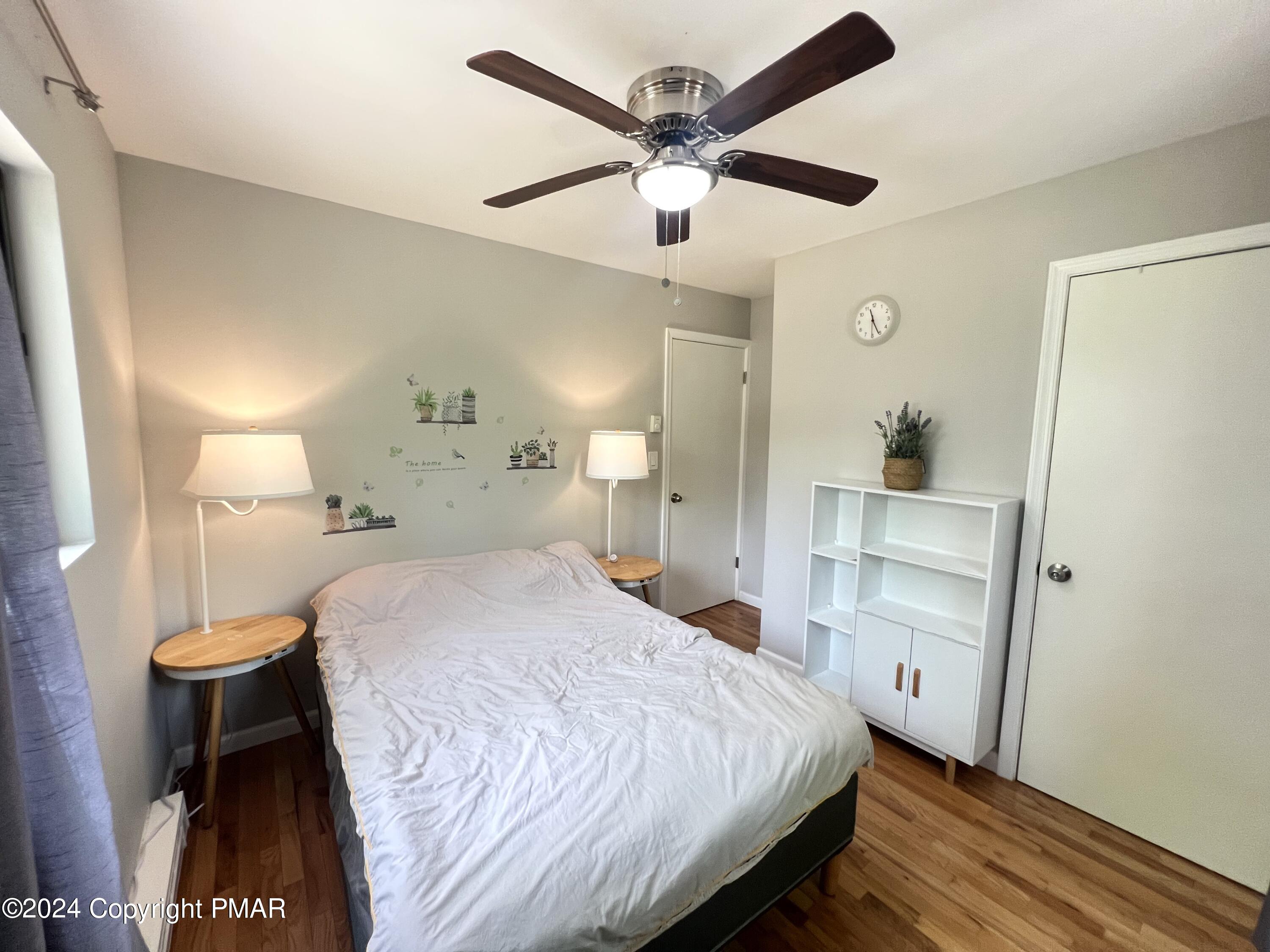 236 Regent Street Bushkill, PA 18324 - Photo 19 of 67 a bedroom with a bed and a ceiling fan