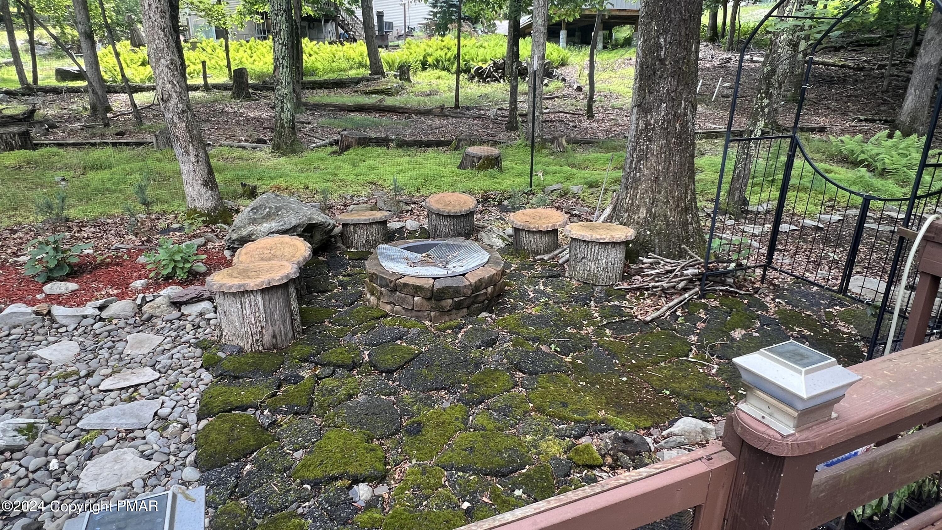 236 Regent Street Bushkill, PA 18324 - Photo 30 of 67 a view of a chairs and table in backyard