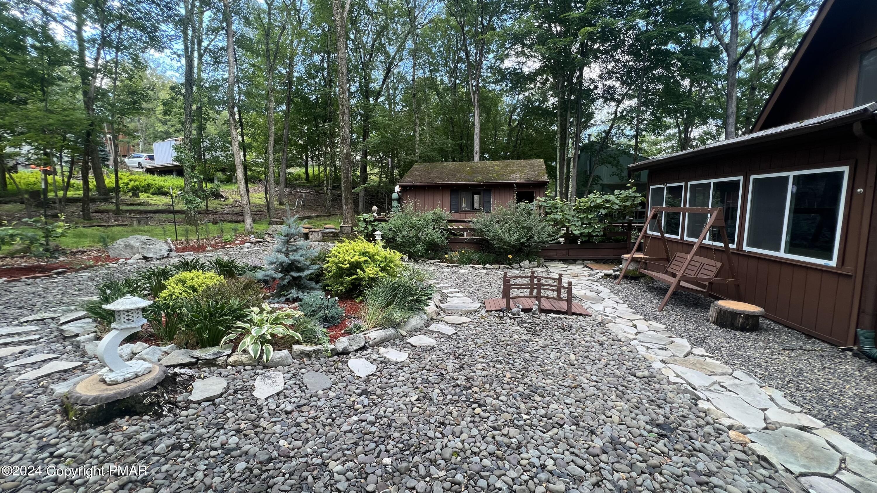236 Regent Street Bushkill, PA 18324 - Photo 35 of 67 a view of a chair and table in backyard
