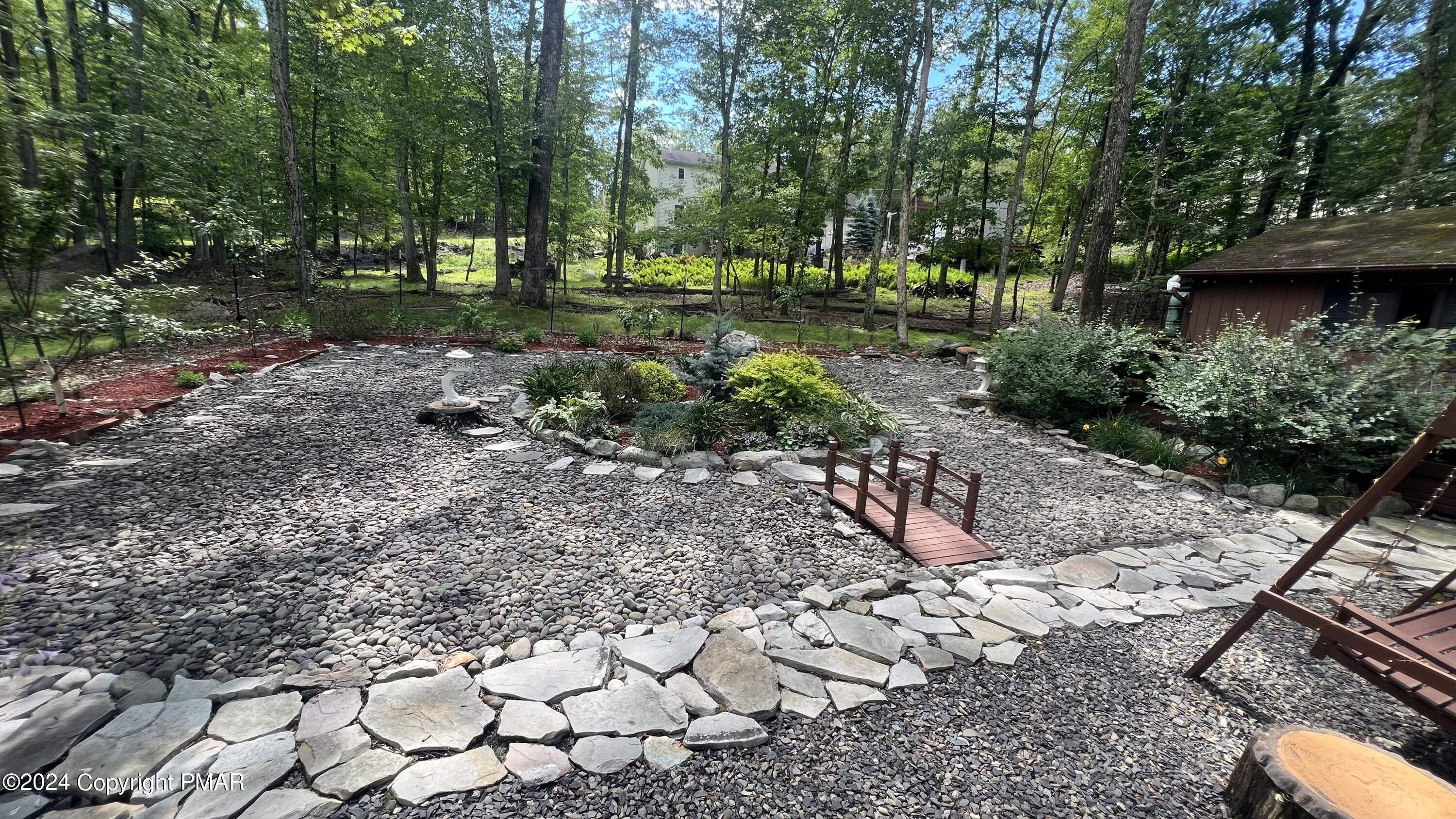 236 Regent Street Bushkill, PA 18324 - Photo 36 of 67 a view of a yard with plants and trees