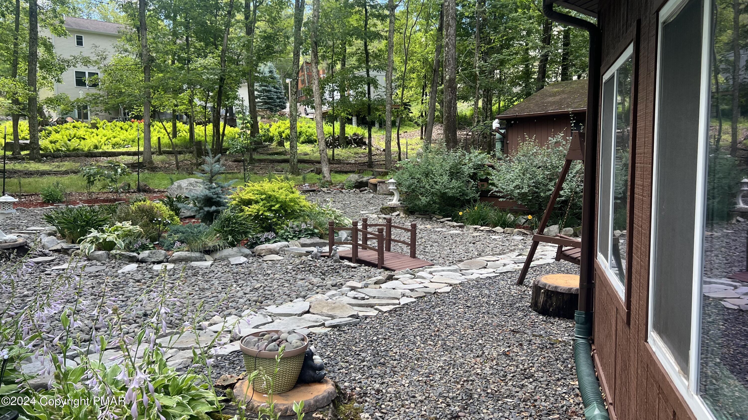 236 Regent Street Bushkill, PA 18324 - Photo 6 of 67 a view of a chairs and table in backyard
