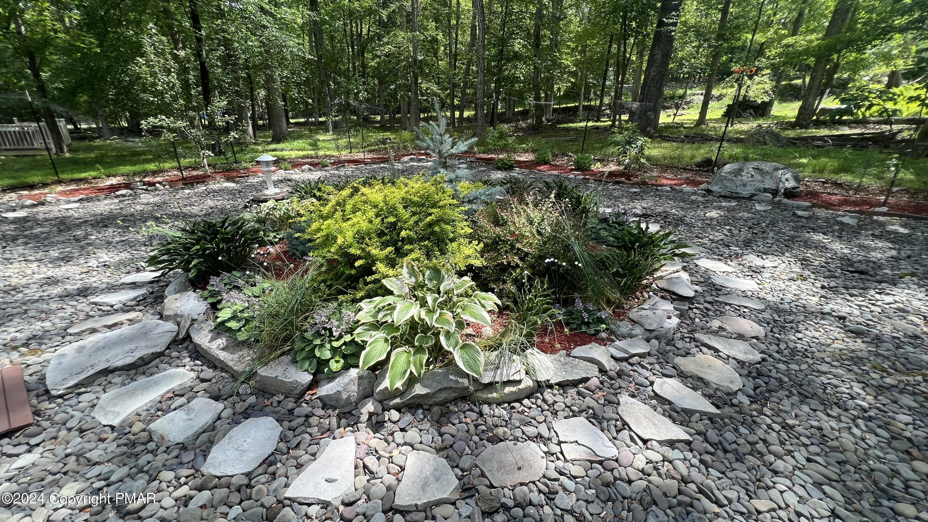 236 Regent Street Bushkill, PA 18324 - Photo 7 of 67 a backyard of a house with a yard and outdoor seating
