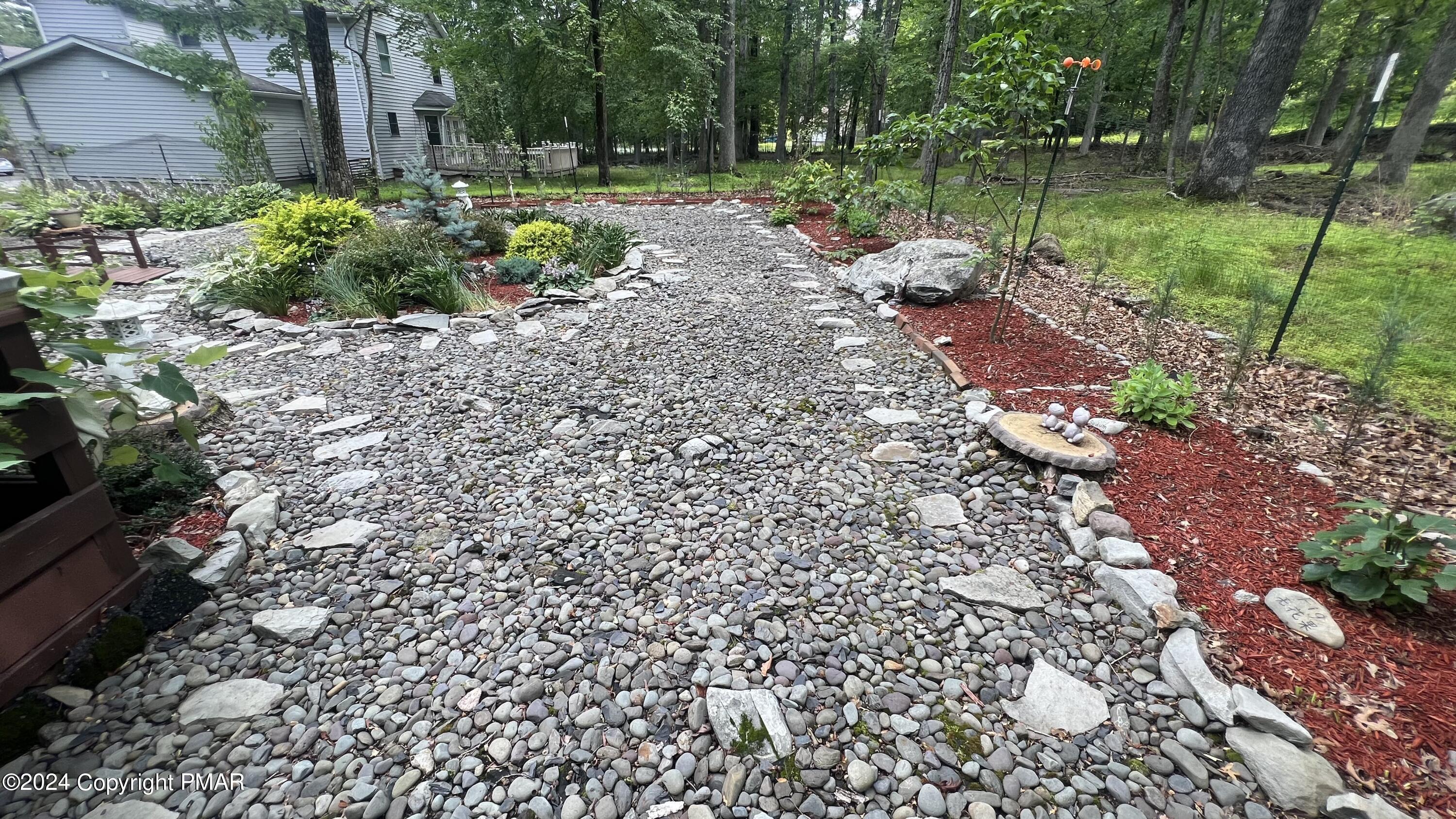 236 Regent Street Bushkill, PA 18324 - Photo 8 of 67 a view of a garden with a fountain