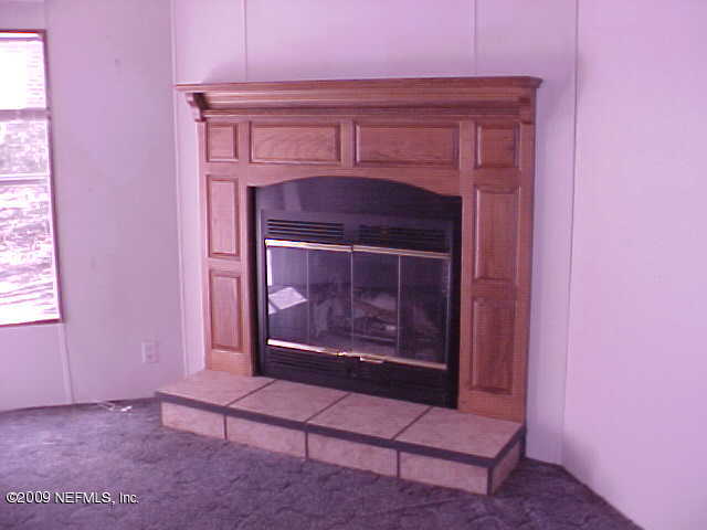 1896 Bellamy Road Florahome, FL 32140 - Photo 2 of 8 Living Rm FP