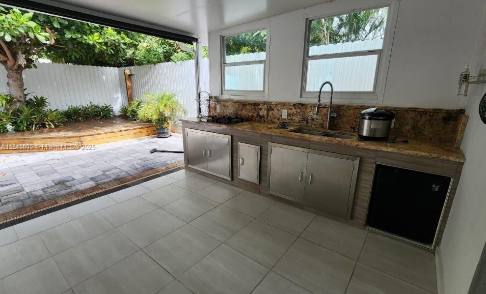 Genesis Lake Worth, FL 33460 - Photo 7 of 7 a kitchen with stainless steel appliances granite countertop a sink and a counter
