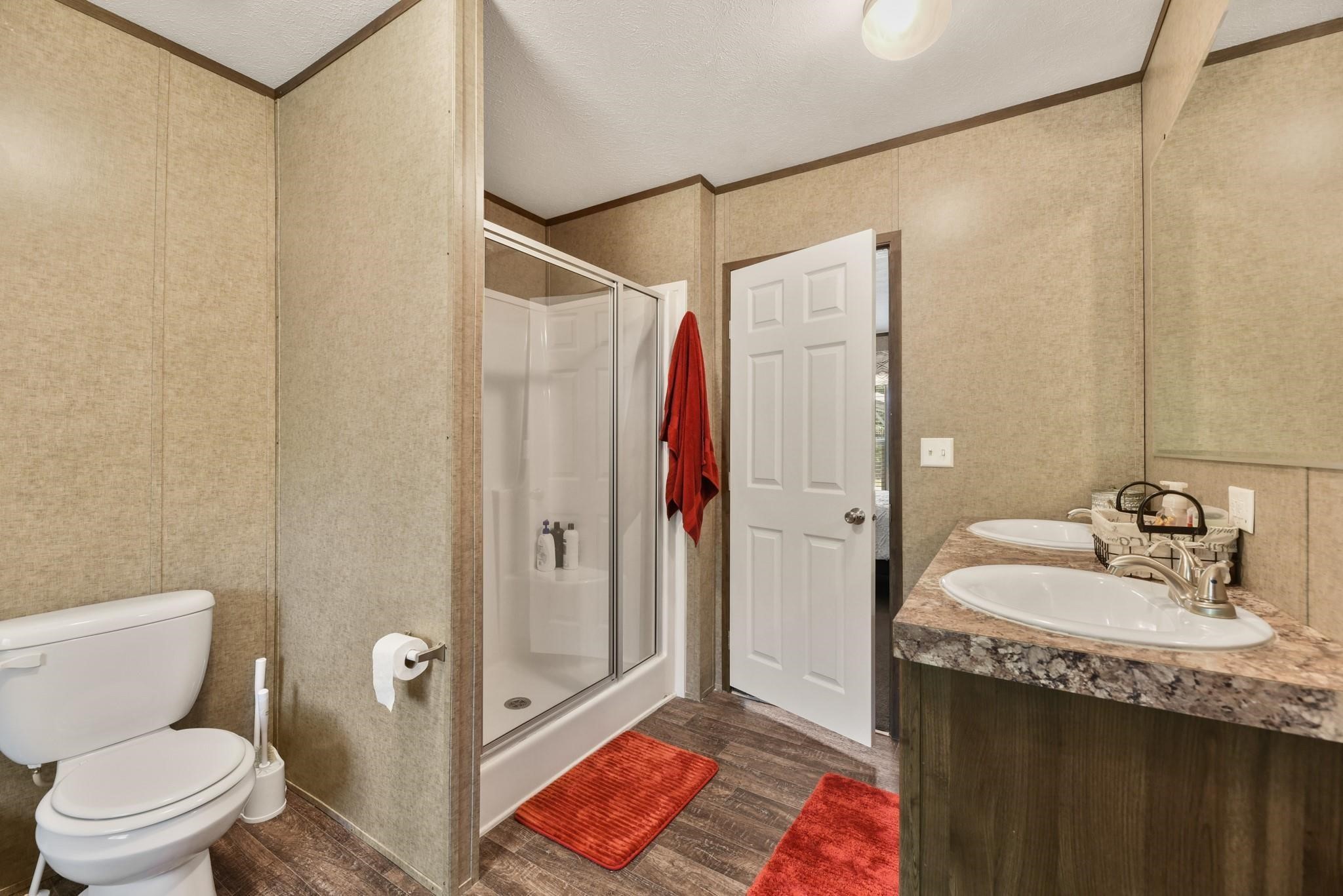 277 Rio Grande Drive Trinity, TX 75862 - Photo 13 of 28 a bathroom with a sink and mirror with toilet
