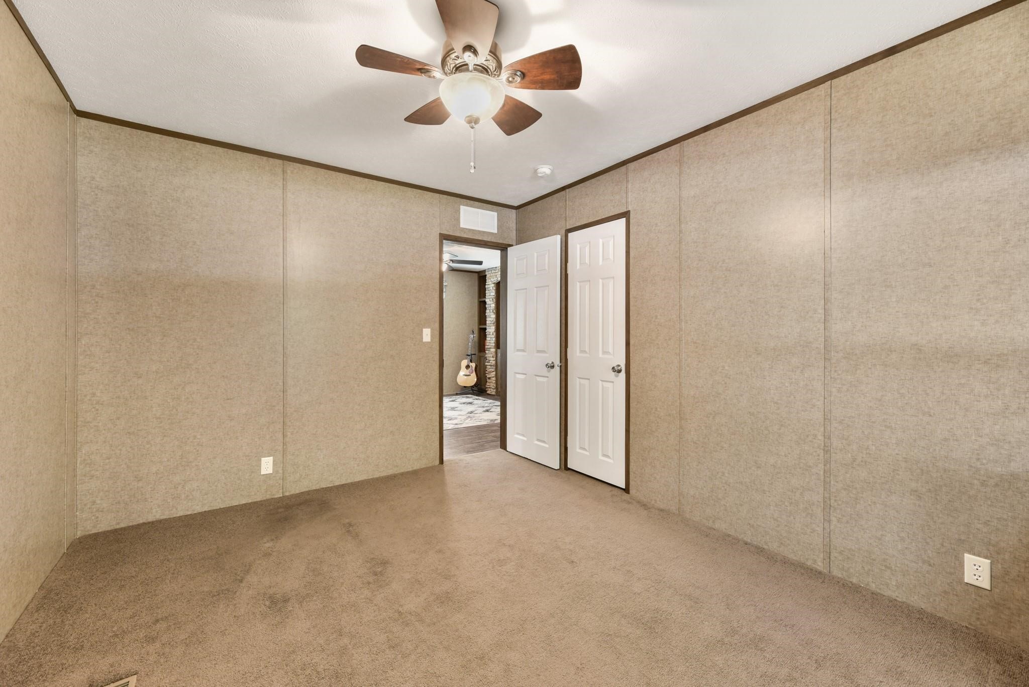 277 Rio Grande Drive Trinity, TX 75862 - Photo 14 of 28 a view of an empty room and a ceiling fan