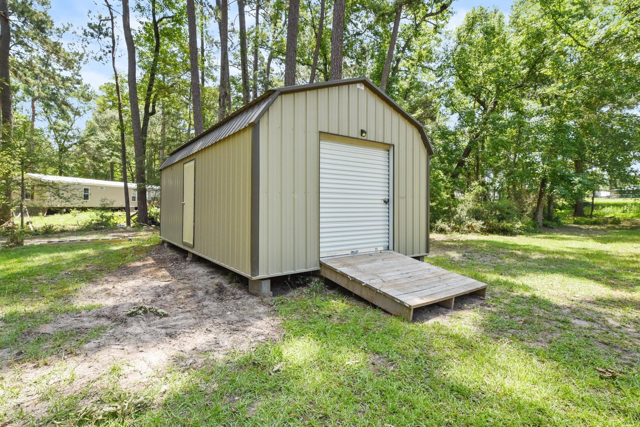 277 Rio Grande Drive Trinity, TX 75862 - Photo 19 of 28 a backyard of a house with lots of green space