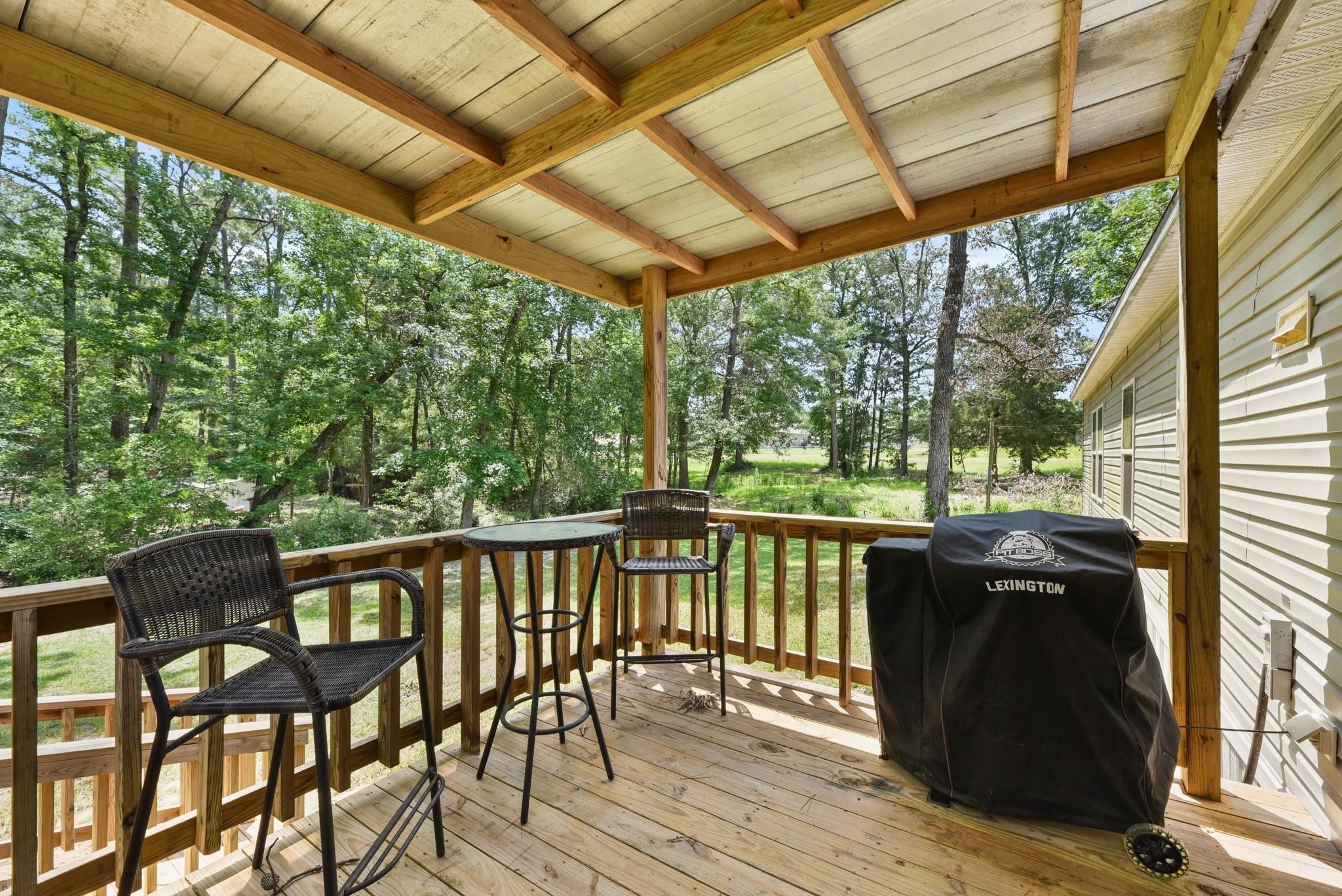 277 Rio Grande Drive Trinity, TX 75862 - Photo 21 of 28 a view of a chairs on the deck
