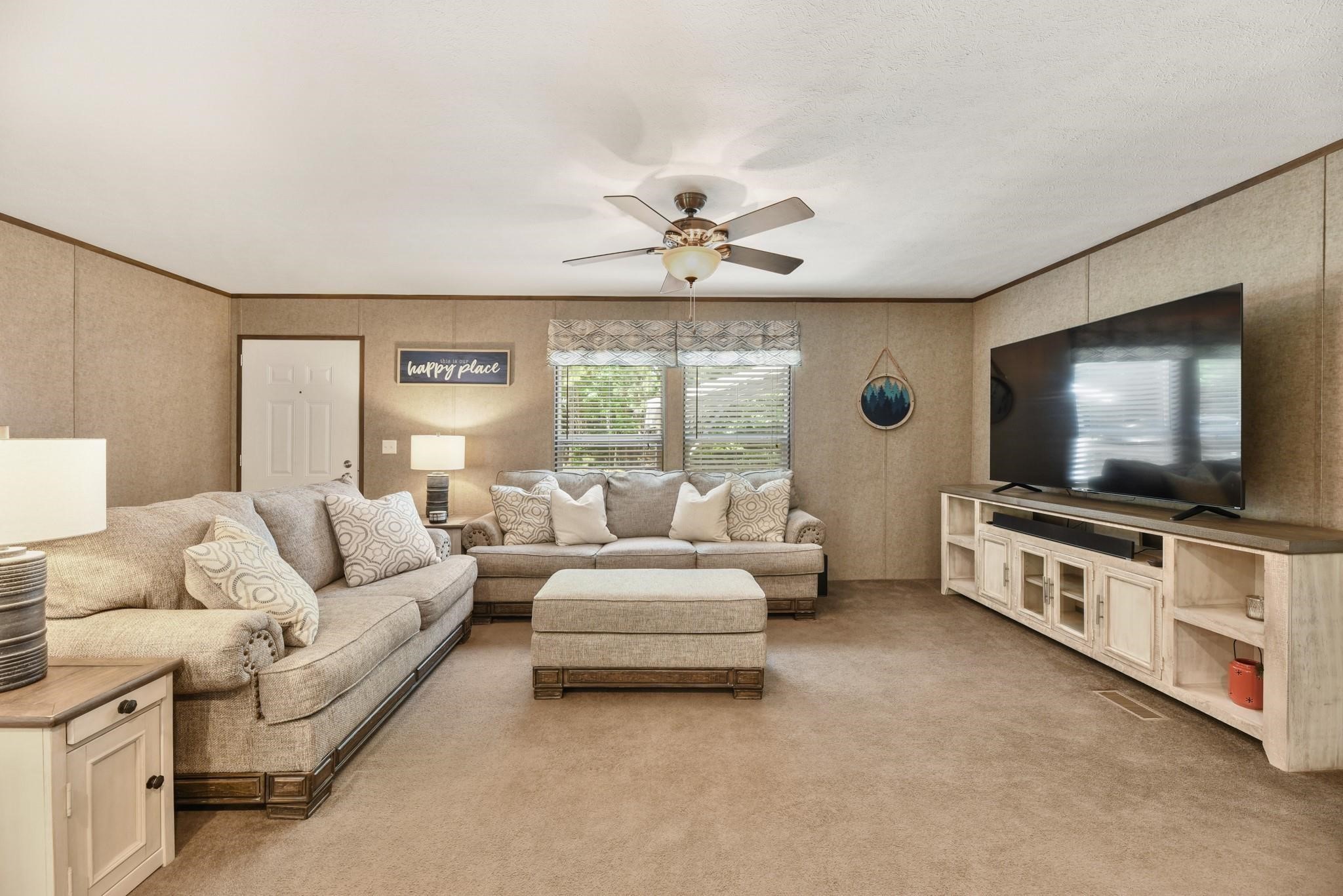 277 Rio Grande Drive Trinity, TX 75862 - Photo 7 of 28 a living room with furniture and a flat screen tv