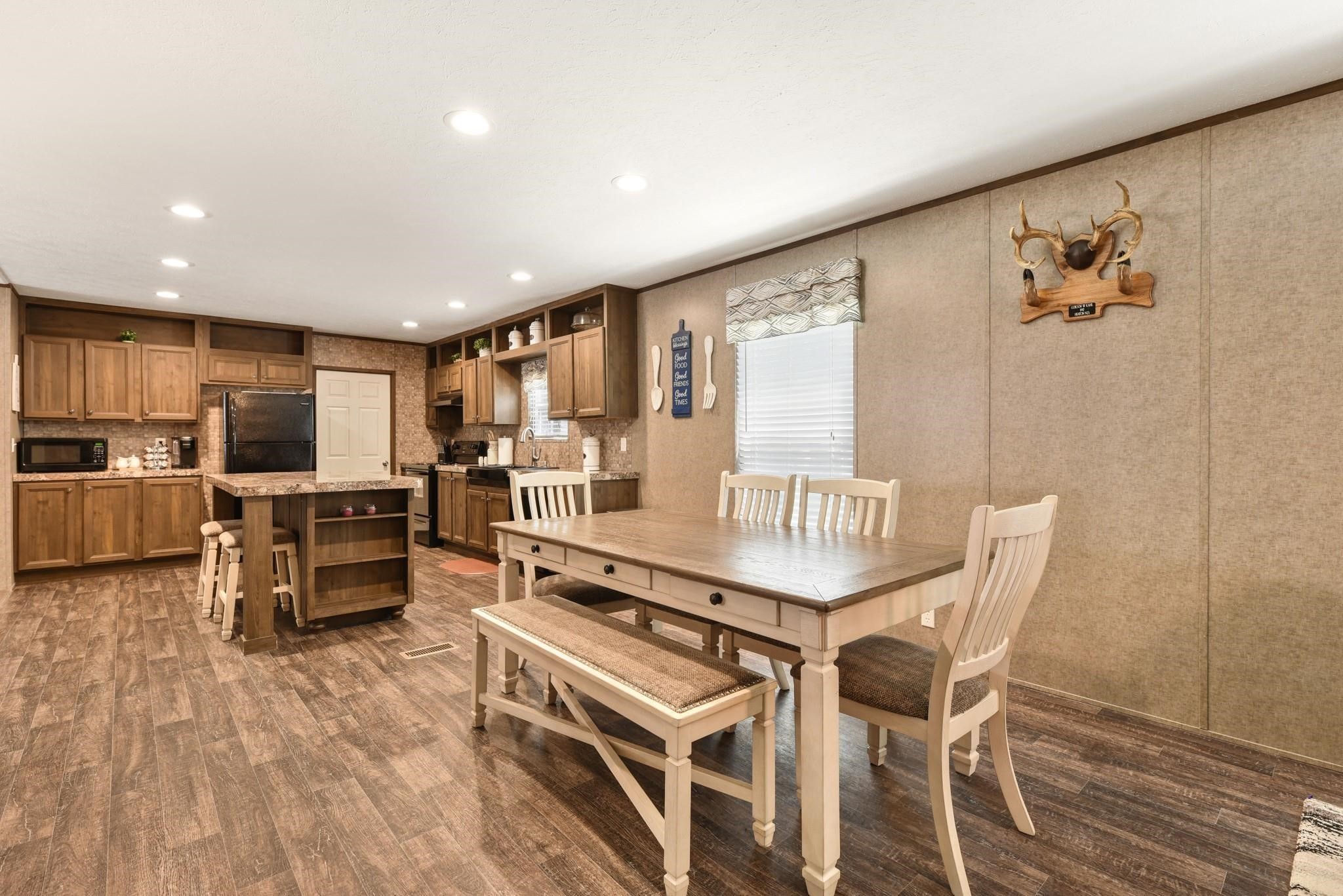 277 Rio Grande Drive Trinity, TX 75862 - Photo 9 of 28 a living room with furniture and kitchen view with wooden floor