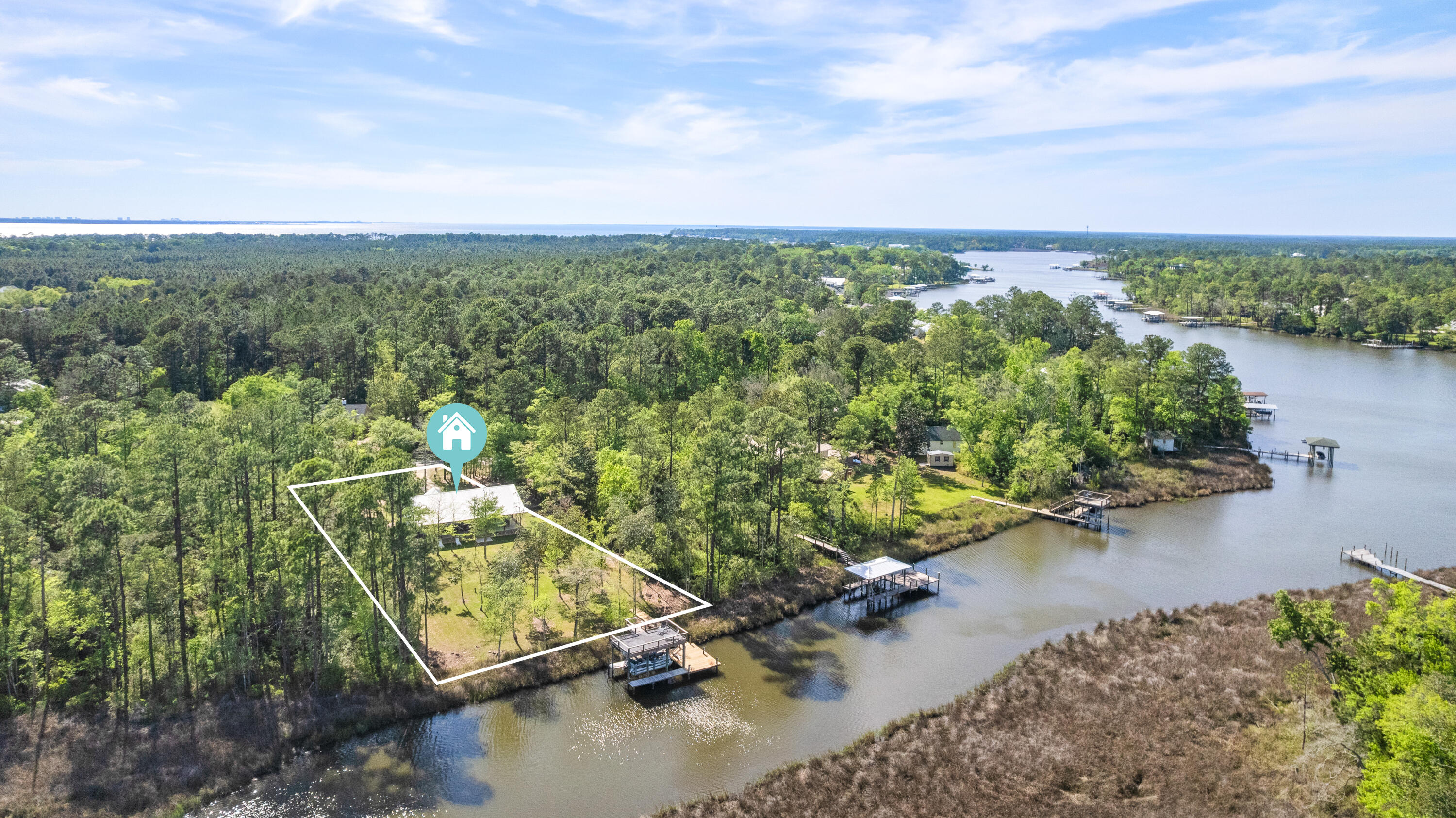 528 Bay Grove Road Freeport, FL 32439 - Photo 65 of 68 an aerial view of a house with a yard and lake view