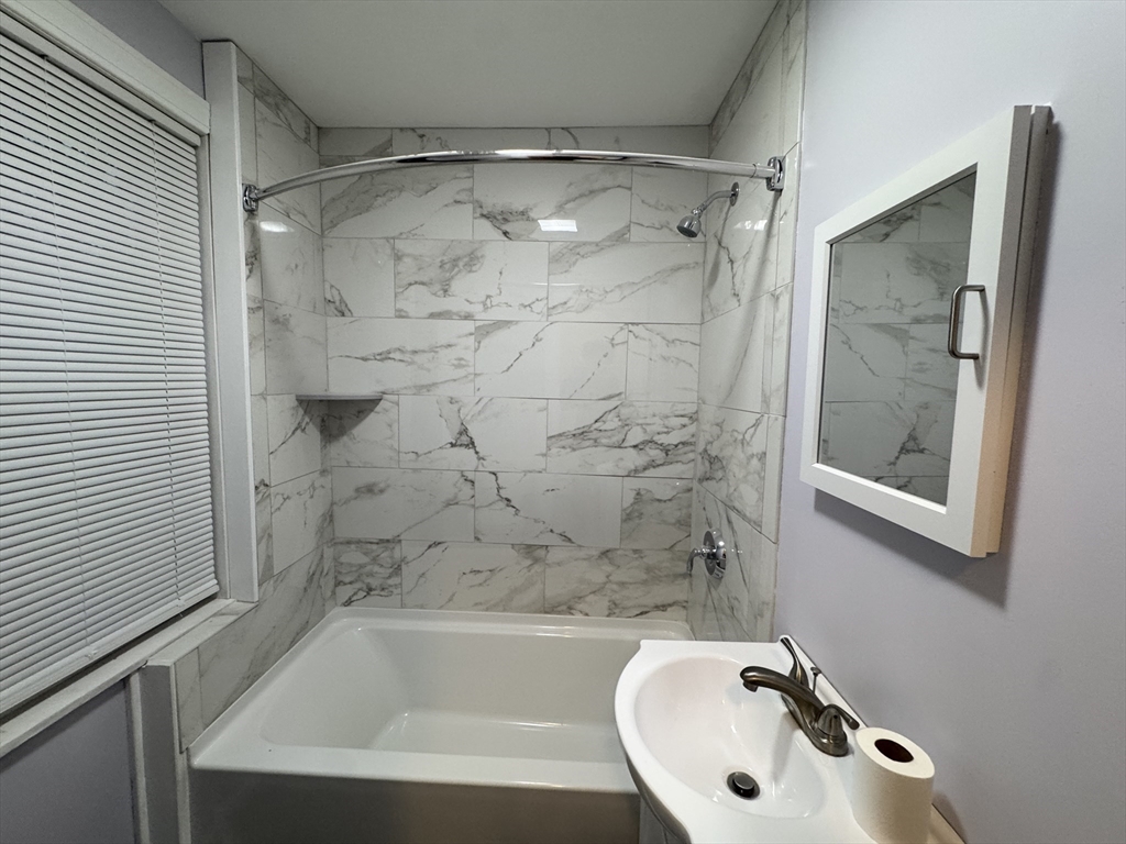 40 Purchase Street, Unit 1 Taunton, MA 02780 - Photo 12 of 14 a bathroom with a bathtub and shower