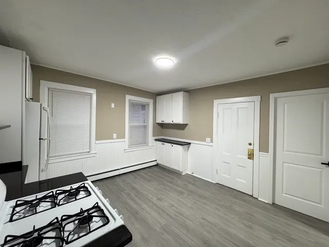 a kitchen with sink and cabinets