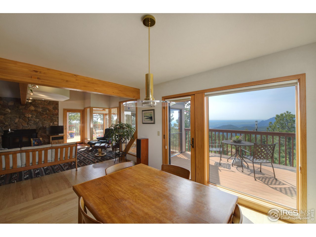 493 Sky Trail Road Boulder, CO 80302 - Photo 12 of 40 a room with lots of large windows and view of dining room