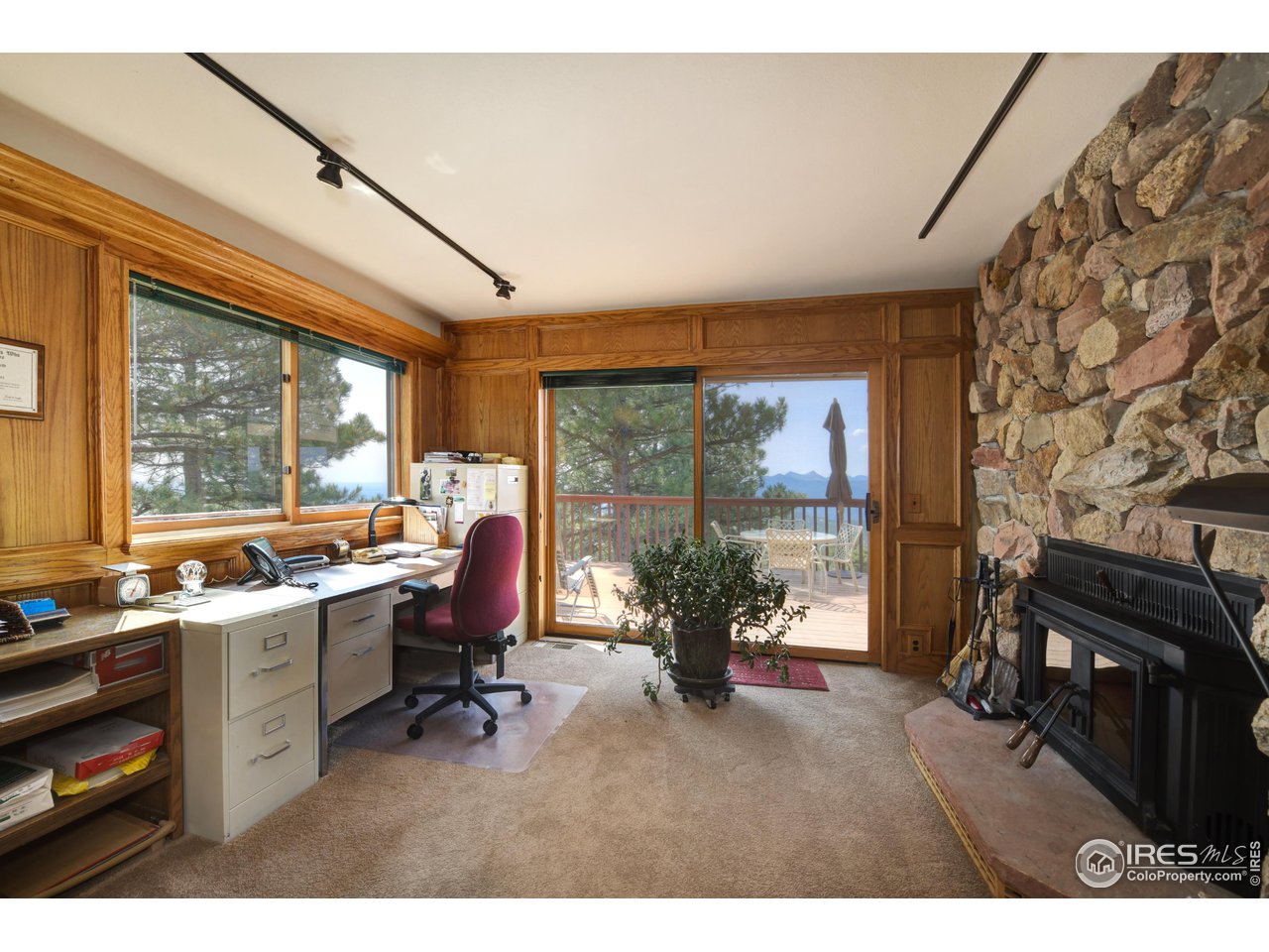 493 Sky Trail Road Boulder, CO 80302 - Photo 13 of 40 a view of a workspace with furniture and a window