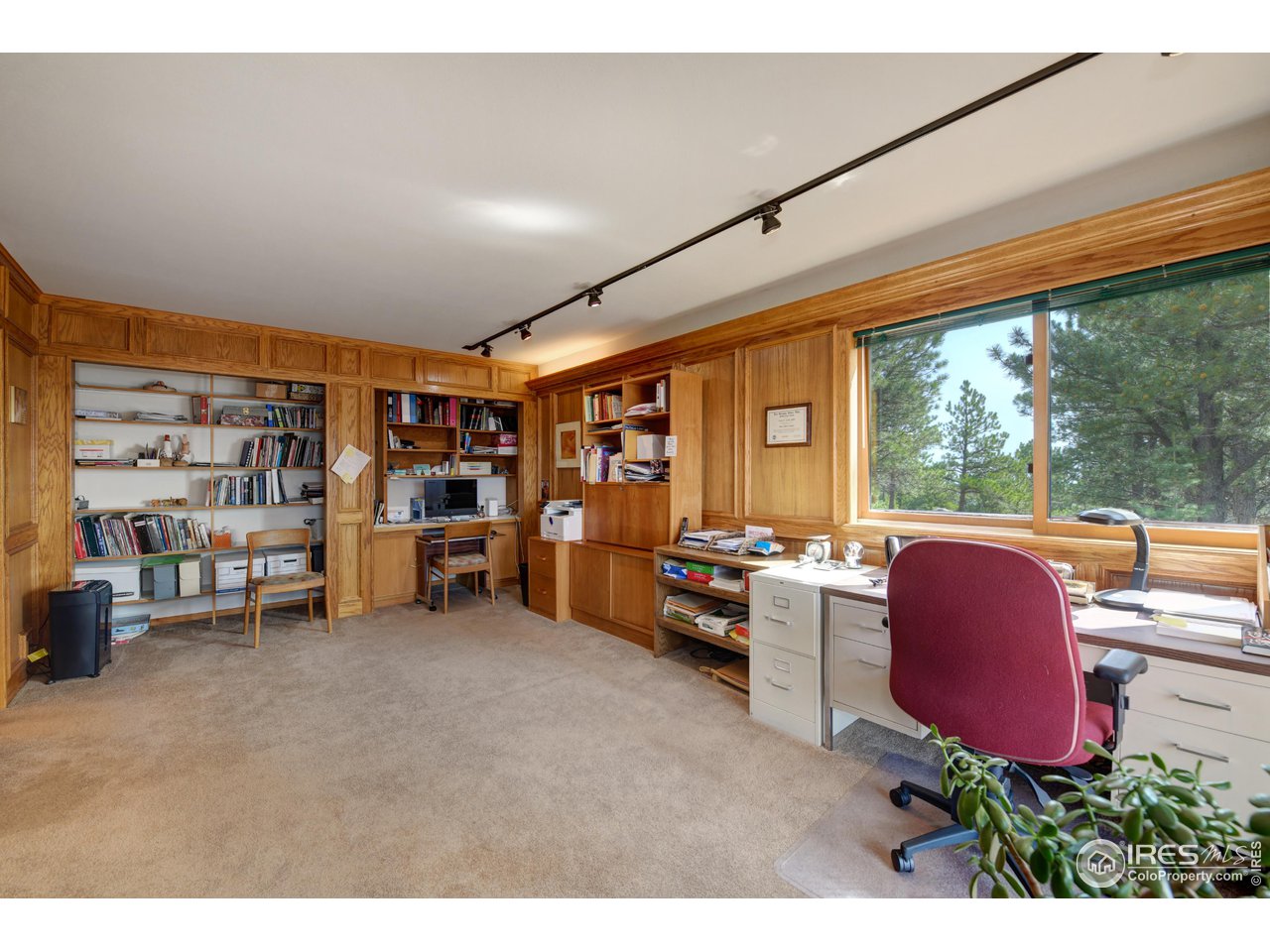 493 Sky Trail Road Boulder, CO 80302 - Photo 14 of 40 a room with furniture and a large window