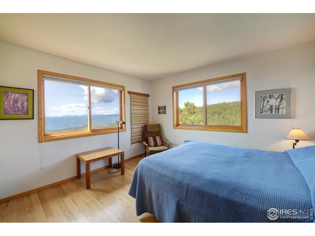 493 Sky Trail Road Boulder, CO 80302 - Photo 18 of 40 a bed sitting in a bedroom next to a window