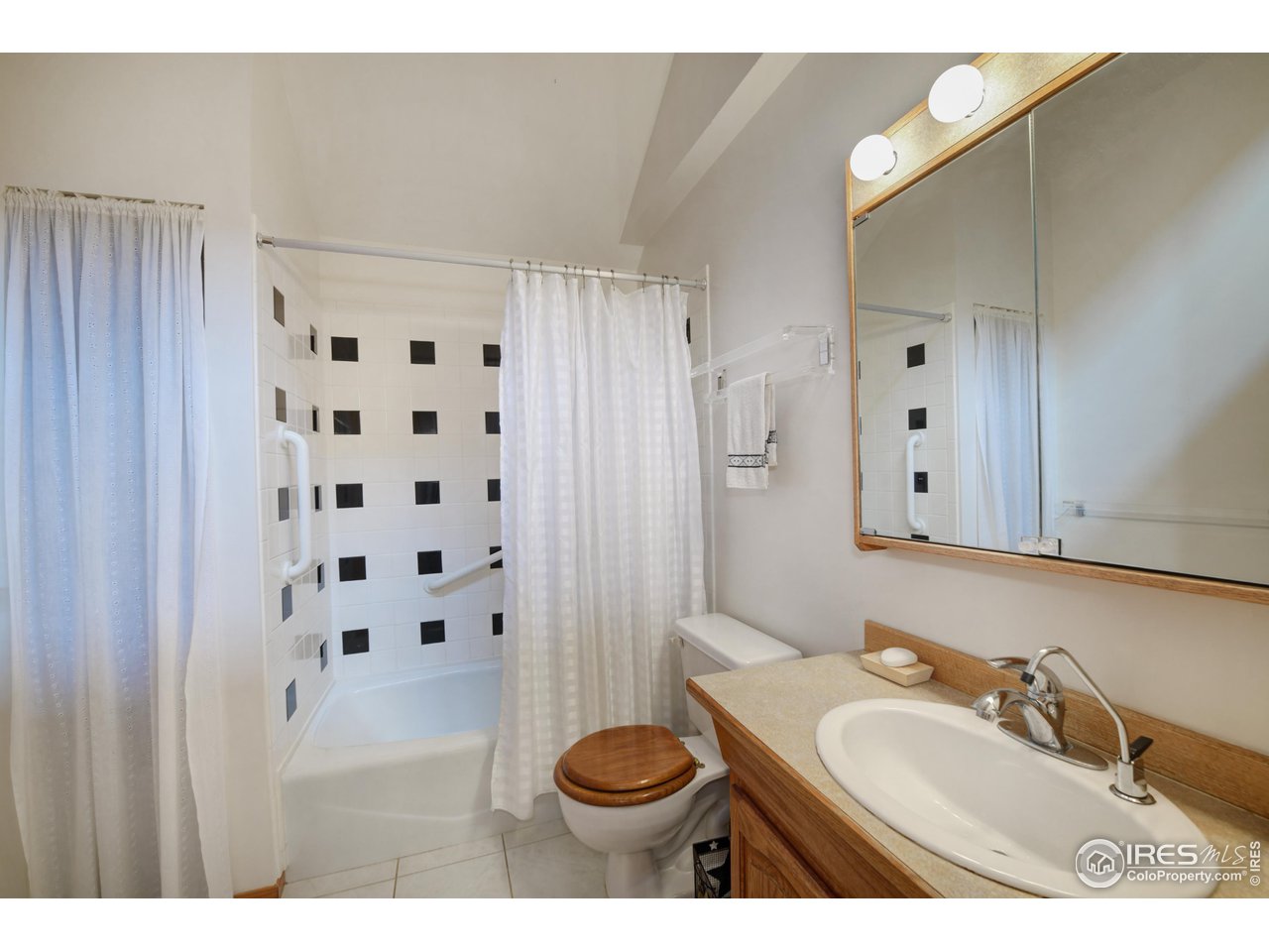 493 Sky Trail Road Boulder, CO 80302 - Photo 19 of 40 a bathroom with a sink a toilet and a mirror