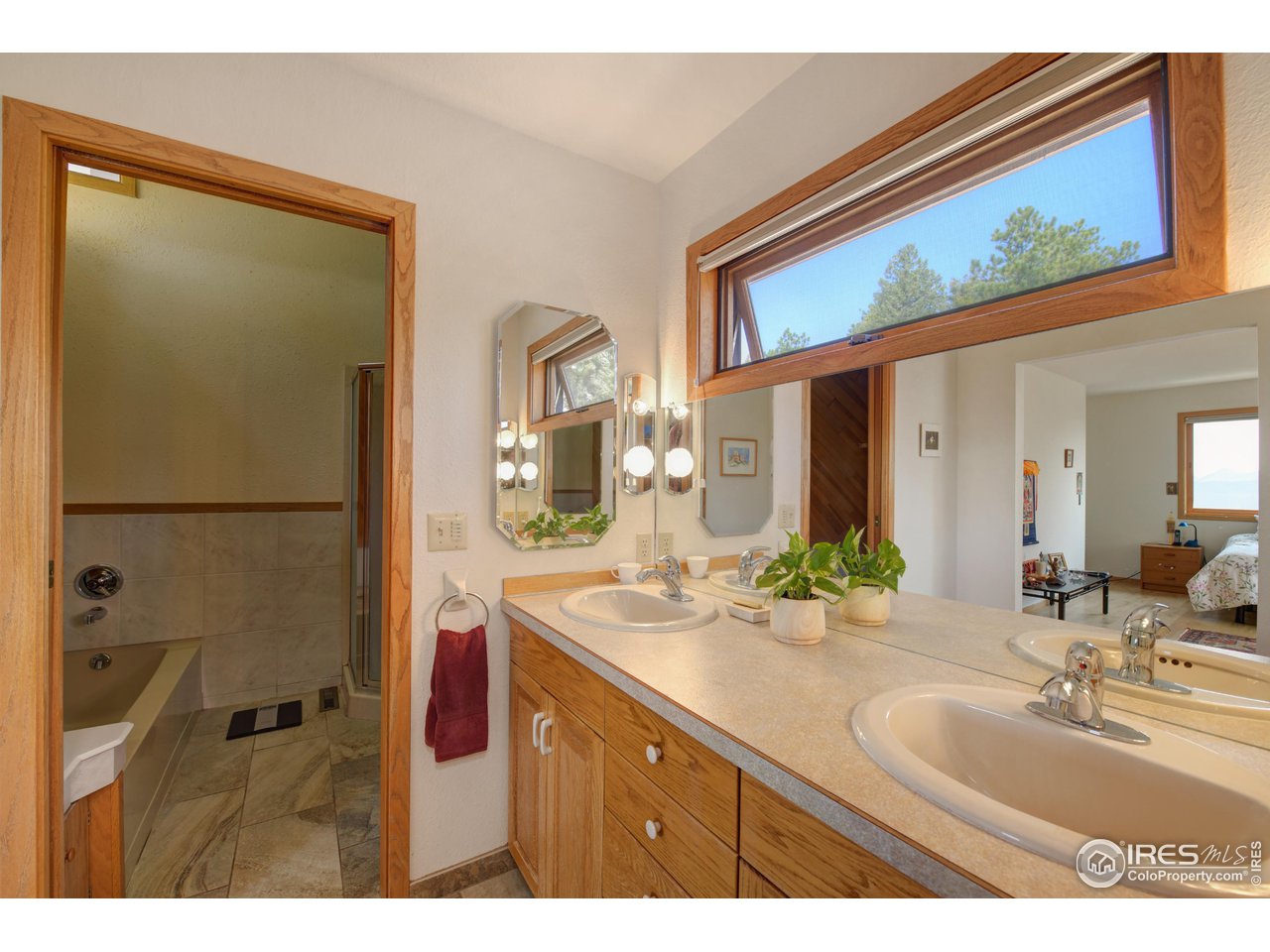 493 Sky Trail Road Boulder, CO 80302 - Photo 21 of 40 a bathroom with a sink and a mirror