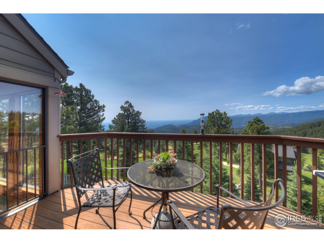 493 Sky Trail Road Boulder, CO 80302 - Photo 30 of 40 a view of a chairs and table in patio