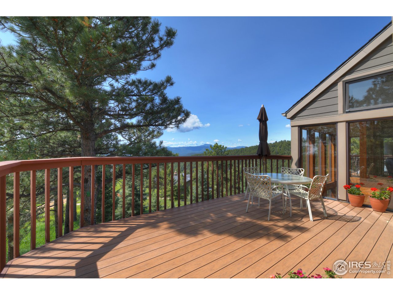 493 Sky Trail Road Boulder, CO 80302 - Photo 33 of 40 a view of a two chairs on the deck