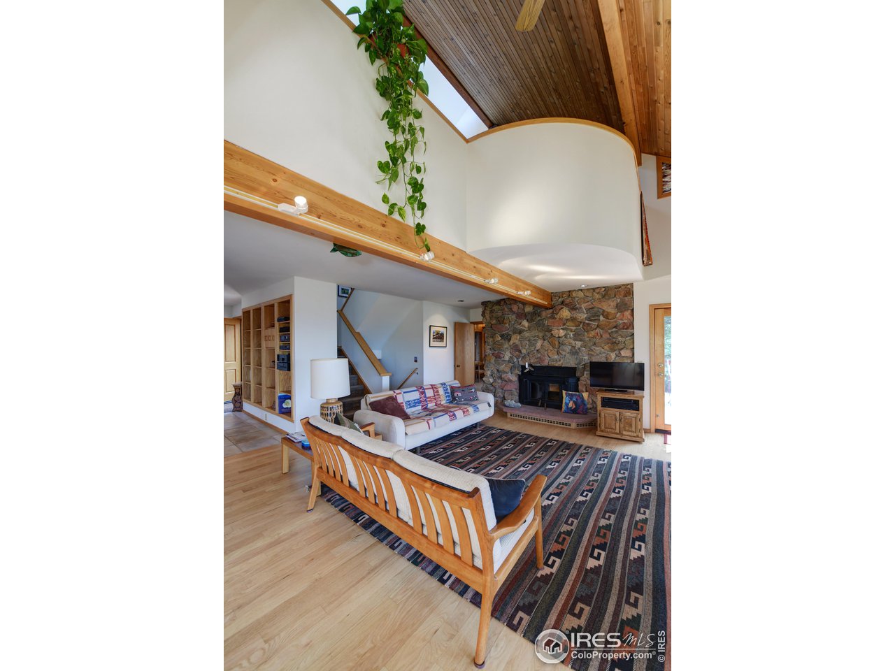 493 Sky Trail Road Boulder, CO 80302 - Photo 7 of 40 a living room with furniture and a fireplace