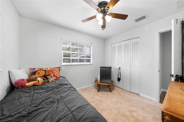 a kitchen with a sink a window and cabinets