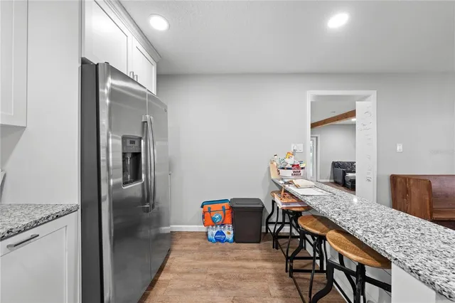 a kitchen with a sink stove and refrigerator