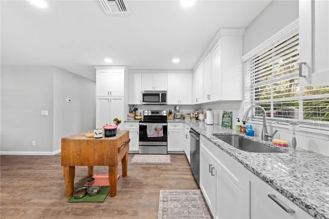 a backyard of a house with outdoor seating