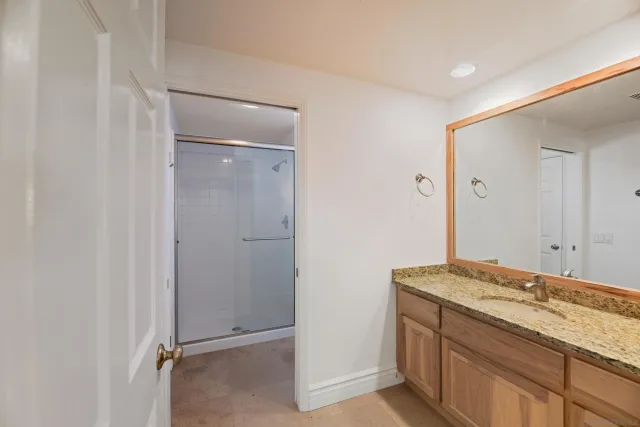 a bedroom with two beds and a couch