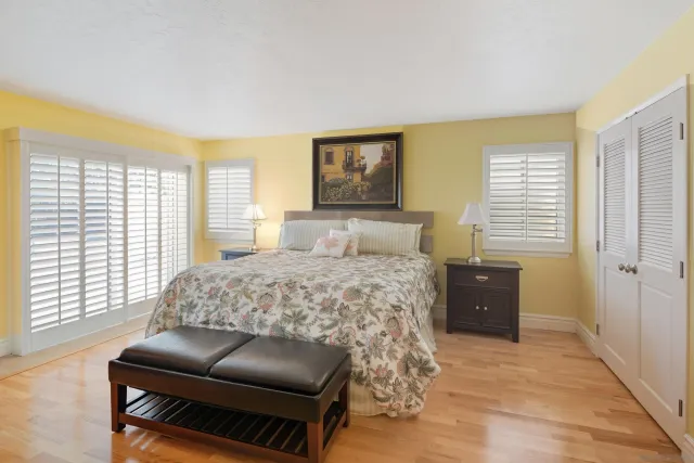 a bedroom with a bed and a television