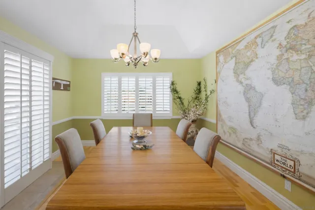 a view of a dining room with furniture window and outside view
