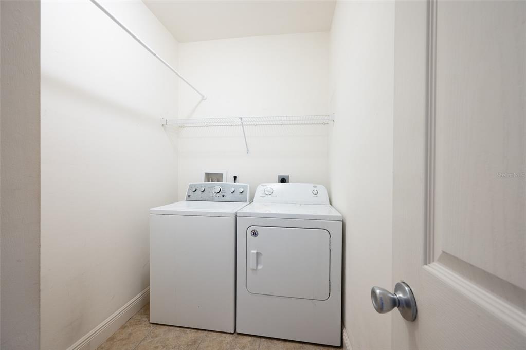 7931 Southwest 88th Street Gainesville, FL 32608 - Photo 14 of 35 a utility room with dryer and washer