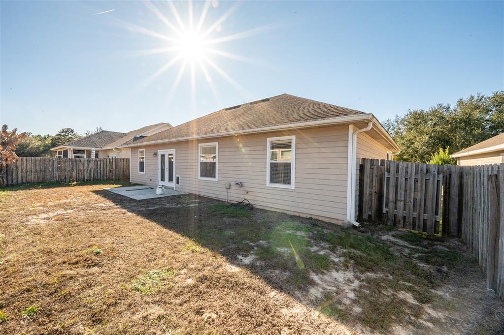 7931 Southwest 88th Street Gainesville, FL 32608 - Photo 30 of 35 a view of a house with a yard