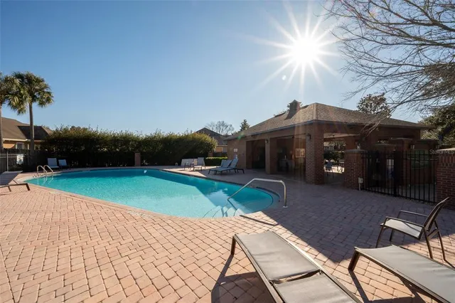 a front view of house with yard and car parked
