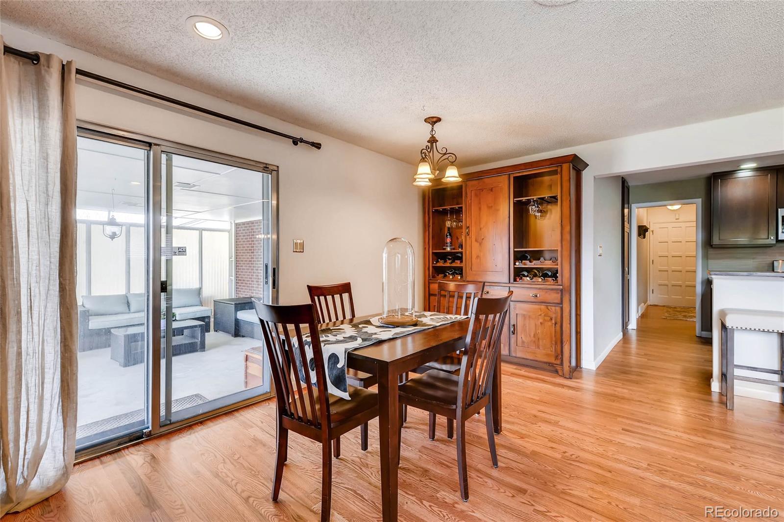 859 South Hudson Street Denver, CO 80246 - Photo 11 of 34 a view of a dining room with furniture and wooden floor