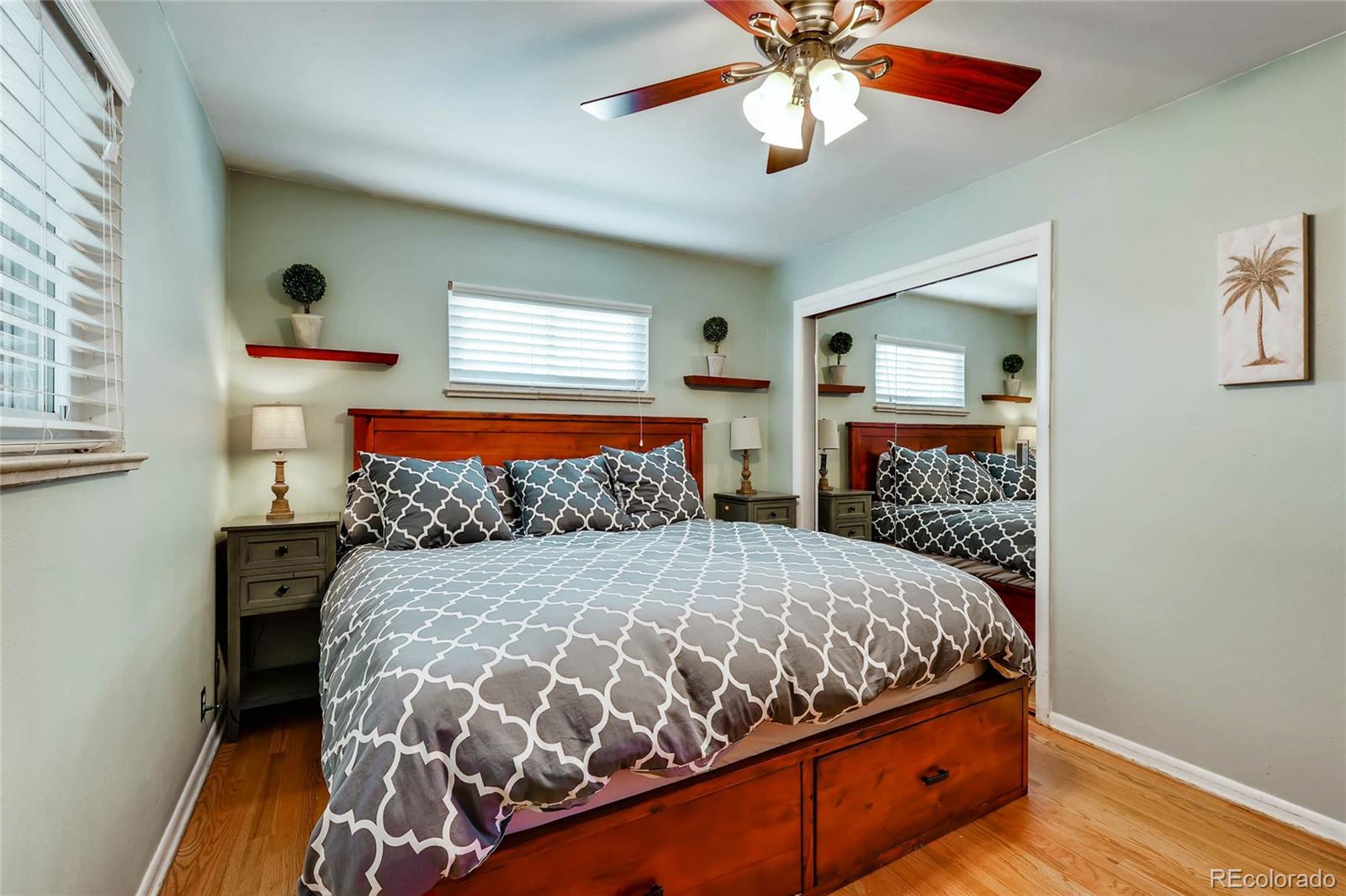 859 South Hudson Street Denver, CO 80246 - Photo 15 of 34 a bedroom with a bed and a chandelier