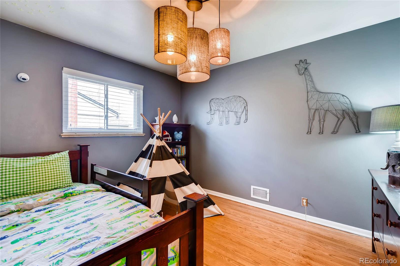 859 South Hudson Street Denver, CO 80246 - Photo 18 of 34 a room with wooden floor and window