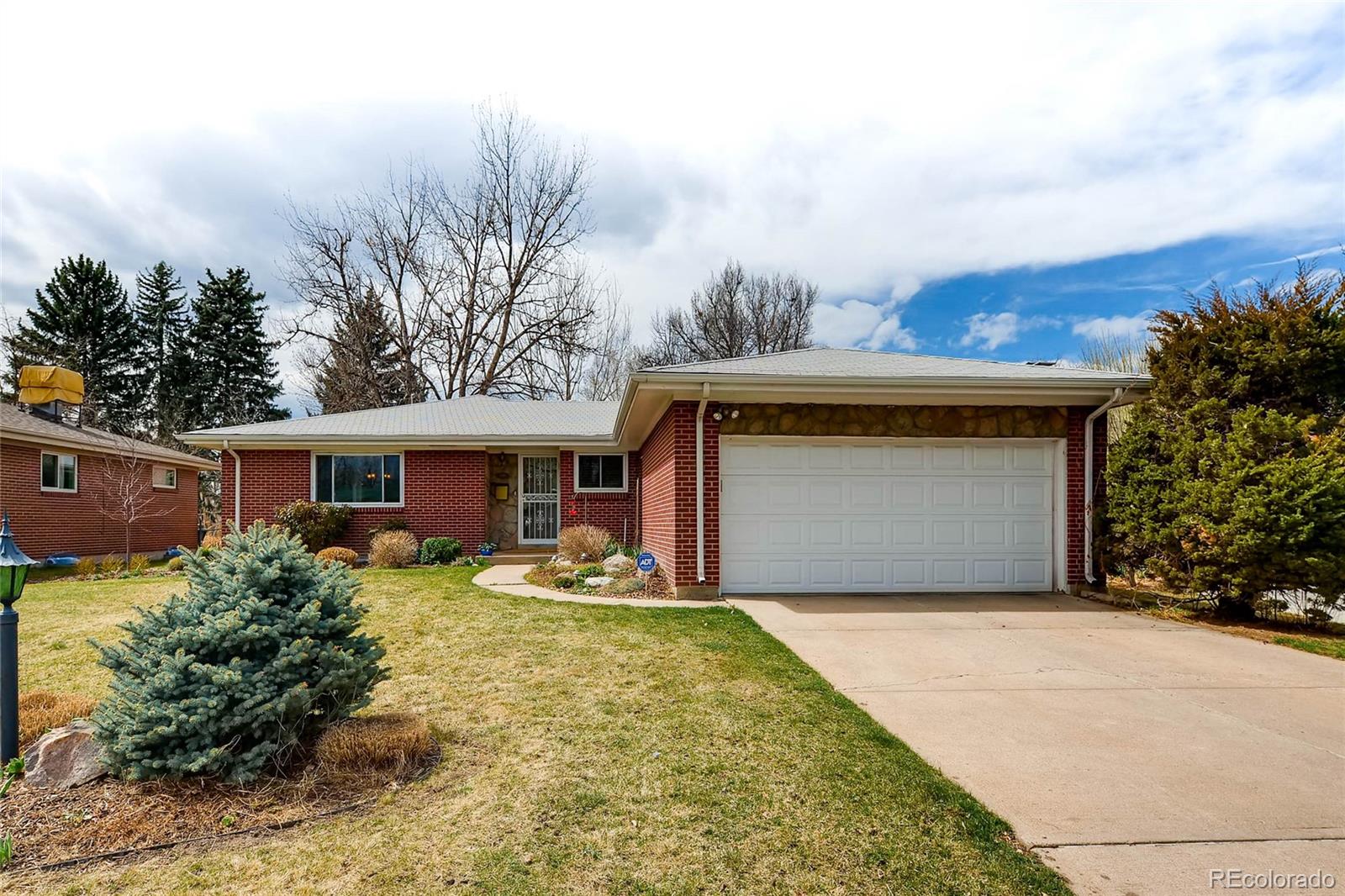 859 South Hudson Street Denver, CO 80246 - Photo 2 of 34 a front view of a house with a yard and garage