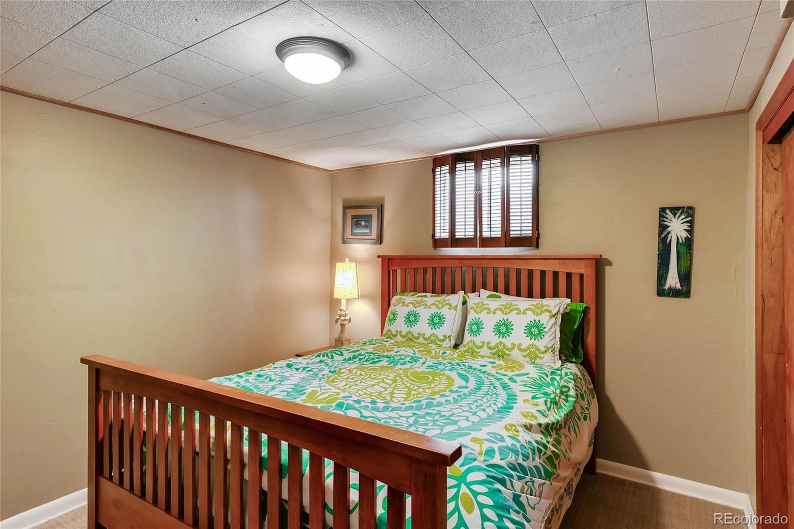 859 South Hudson Street Denver, CO 80246 - Photo 24 of 34 a bedroom with bed and window